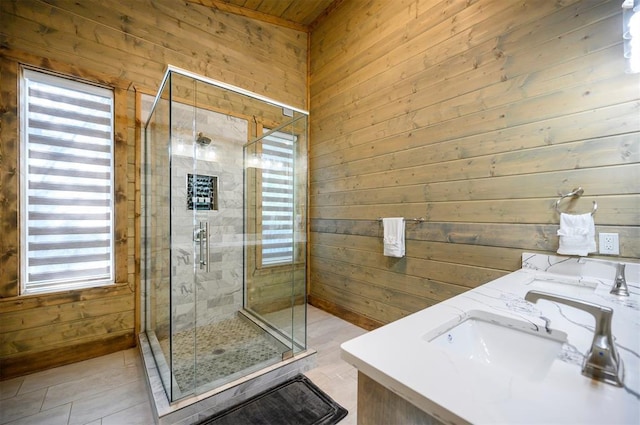 66 Morning Pines Trl, Broken Bow, OK 74728 - bathroom with tile patterned flooring, a sink, wood walls, and a shower stall