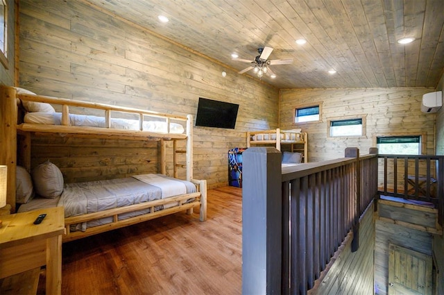 66 Morning Pines Trl, Broken Bow, OK 74728 - bedroom featuring wood walls, lofted ceiling, wood finished floors, and wooden ceiling