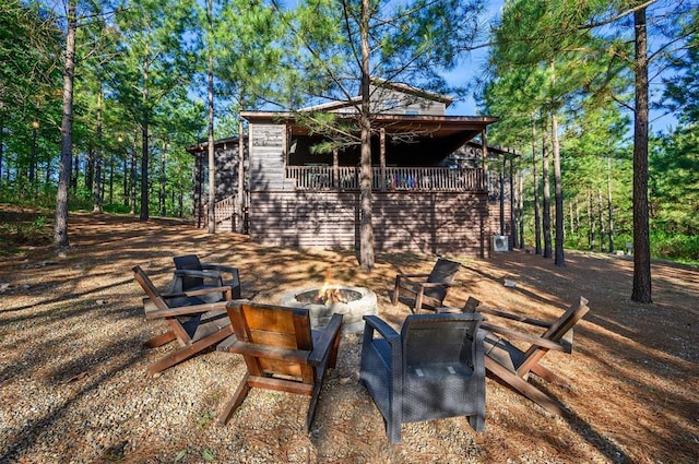 66 Morning Pines Trl, Broken Bow, OK 74728 - exterior space featuring a balcony and an outdoor fire pit