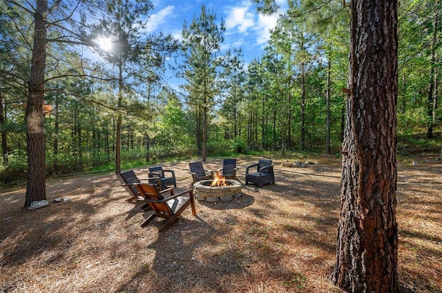 66 Morning Pines Trl, Broken Bow, OK 74728 - view of yard with a view of trees and an outdoor fire pit