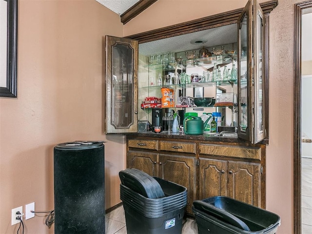 12141 Greenlawn Ave, Oklahoma City, OK 73170 - bar with a textured ceiling and light tile patterned floors
