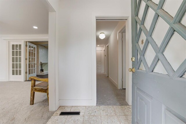 hallway with light colored carpet, visible vents, and recessed lighting