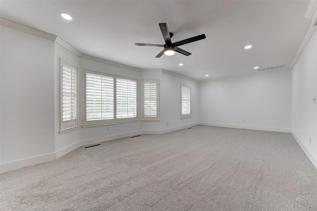empty room with visible vents, ceiling fan, crown molding, and recessed lighting
