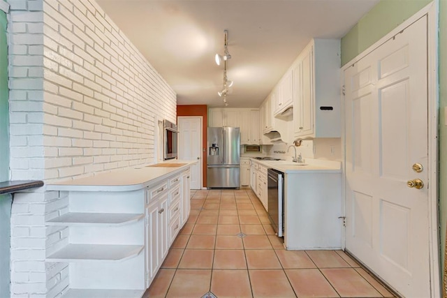 kitchen featuring stainless steel appliances, light tile patterned flooring, open shelves, light countertops, and white cabinets