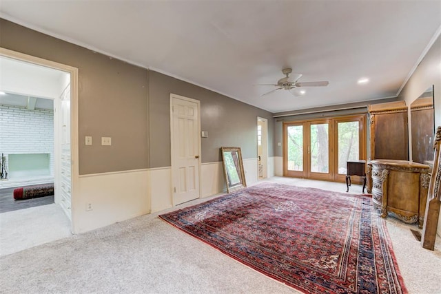 interior space featuring ornamental molding and a ceiling fan