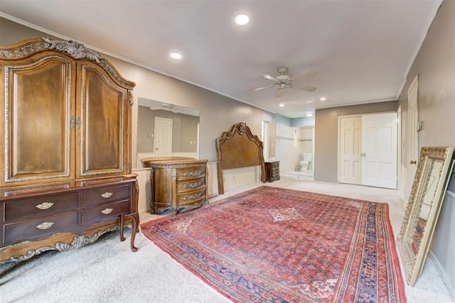 bedroom featuring recessed lighting, ensuite bath, crown molding, and carpet flooring