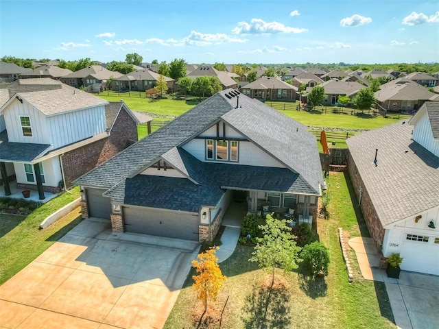 3760 Black Mesa Rd, Norman, OK 73071 - view of front of home with a shingled roof, a garage, a residential view, and driveway