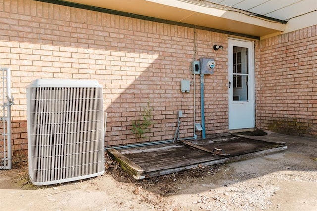 4108 N Broadway Ave, Hinton, OK 73047 - view of exterior entry featuring central AC and brick siding