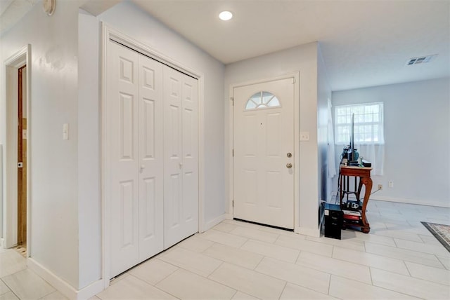 entrance foyer featuring baseboards, visible vents, and recessed lighting
