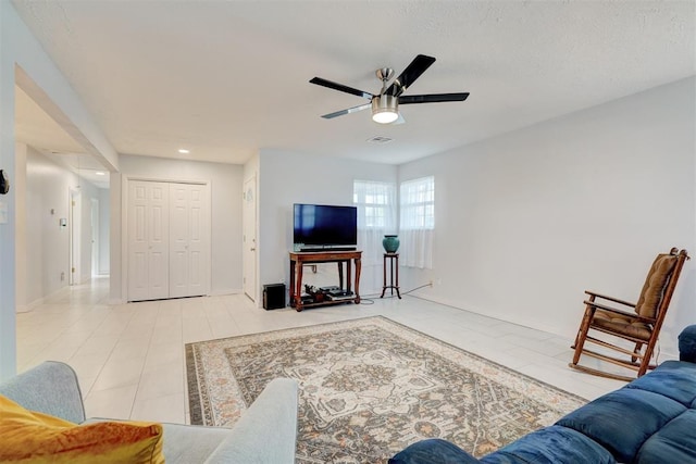 living room with recessed lighting, a ceiling fan, visible vents, and light tile patterned floors