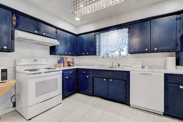 kitchen with a sink, white appliances, blue cabinetry, light countertops, and under cabinet range hood