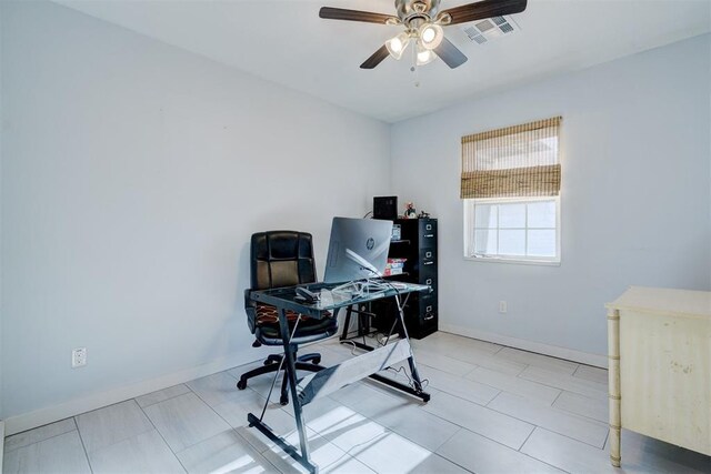 office area with baseboards, a ceiling fan, tile patterned flooring, and visible vents