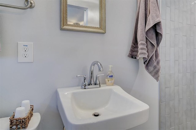 bathroom featuring toilet and a sink