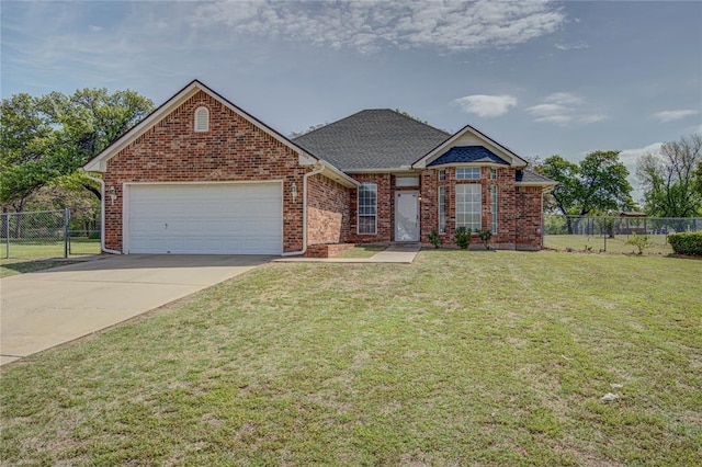 view of front facade with an attached garage, driveway, a front yard, and fence