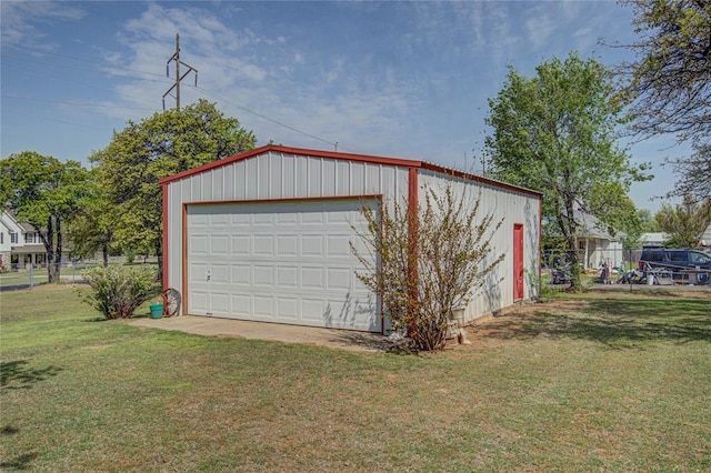 detached garage featuring fence