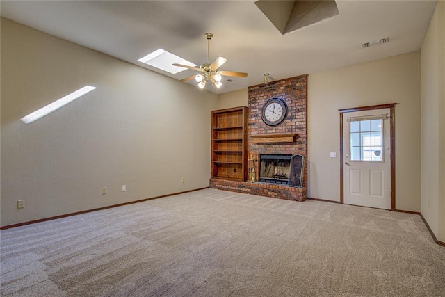 unfurnished living room featuring light carpet, visible vents, baseboards, a ceiling fan, and a brick fireplace