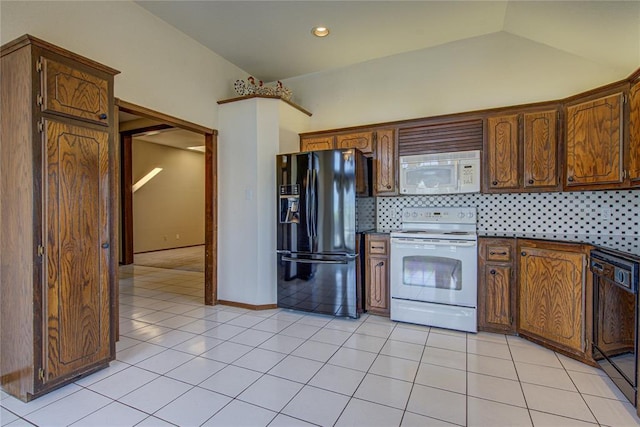 kitchen with black appliances, decorative backsplash, dark countertops, and light tile patterned flooring