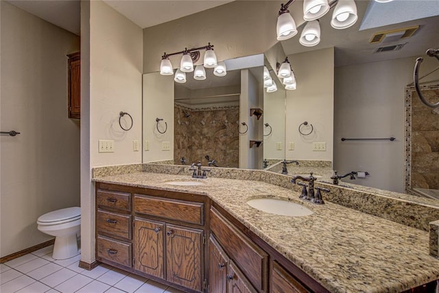 bathroom with tile patterned floors, visible vents, a sink, and toilet