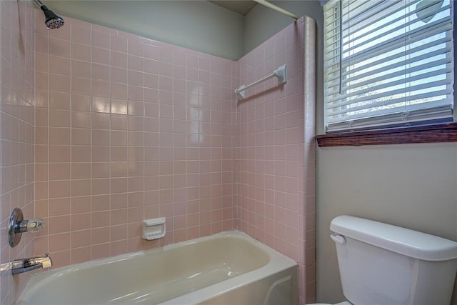 bathroom featuring toilet and  shower combination