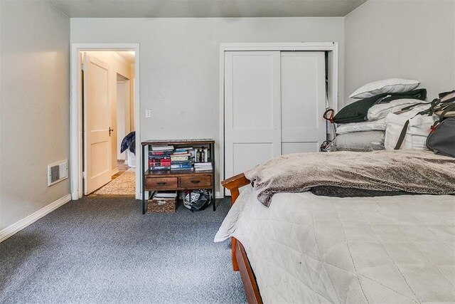 1115 W Eufaula St, Norman, OK 73069 - bedroom with baseboards, visible vents, a closet, and carpet flooring
