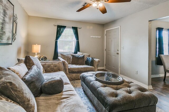1115 W Eufaula St, Norman, OK 73069 - living room featuring wood finished floors, visible vents, a ceiling fan, and baseboards
