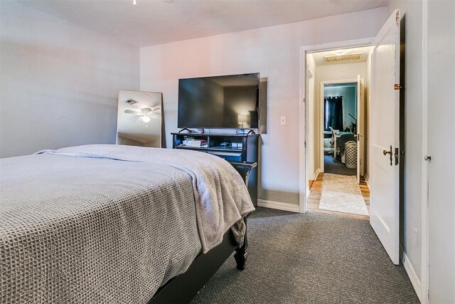 1115 W Eufaula St, Norman, OK 73069 - carpeted bedroom with baseboards and visible vents