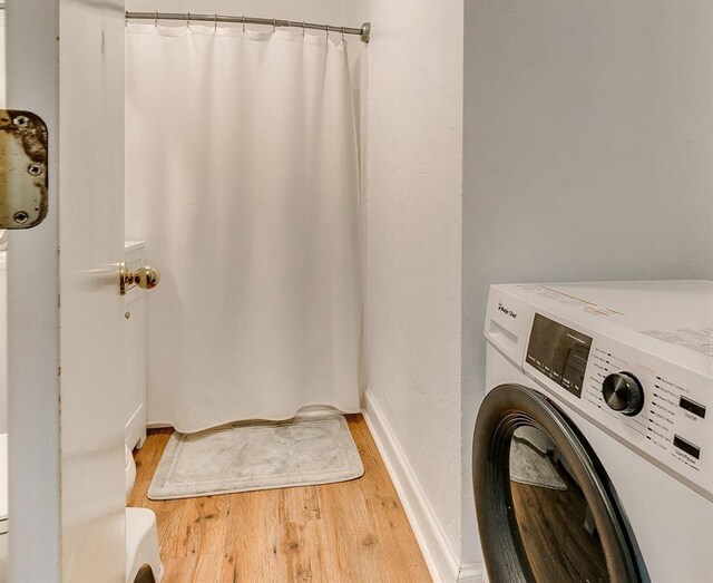 1115 W Eufaula St, Norman, OK 73069 - clothes washing area featuring light wood-style floors, baseboards, laundry area, and washer / clothes dryer