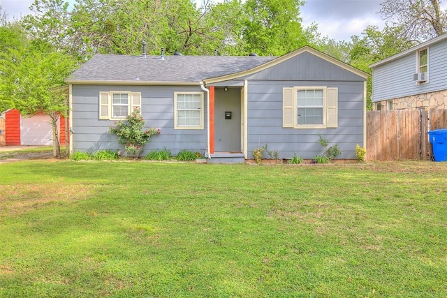 1115 W Eufaula St, Norman, OK 73069 - ranch-style house featuring cooling unit, a shingled roof, a front lawn, and fence