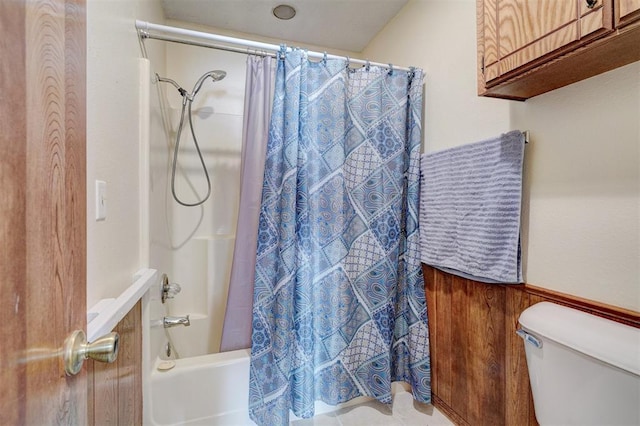 full bath with shower / tub combo and toilet