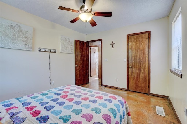bedroom with baseboards, a ceiling fan, visible vents, and a closet