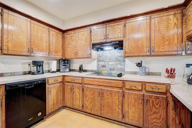 kitchen featuring brown cabinetry, black appliances, under cabinet range hood, and light countertops