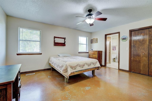 bedroom with a ceiling fan, a textured ceiling, baseboards, ensuite bath, and visible vents