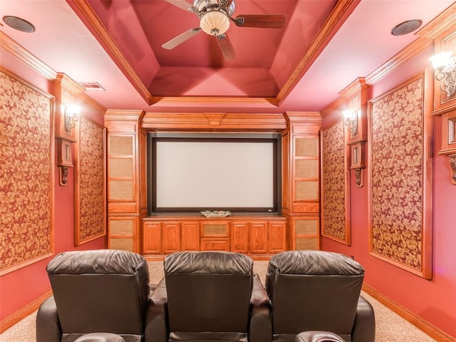 3116 Sycamore Dr, Moore, OK 73160 - carpeted home theater room featuring ornamental molding, ceiling fan, baseboards, visible vents, and a raised ceiling