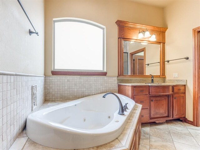 3116 Sycamore Dr, Moore, OK 73160 - full bathroom featuring a tub with jets, tile patterned flooring, and vanity