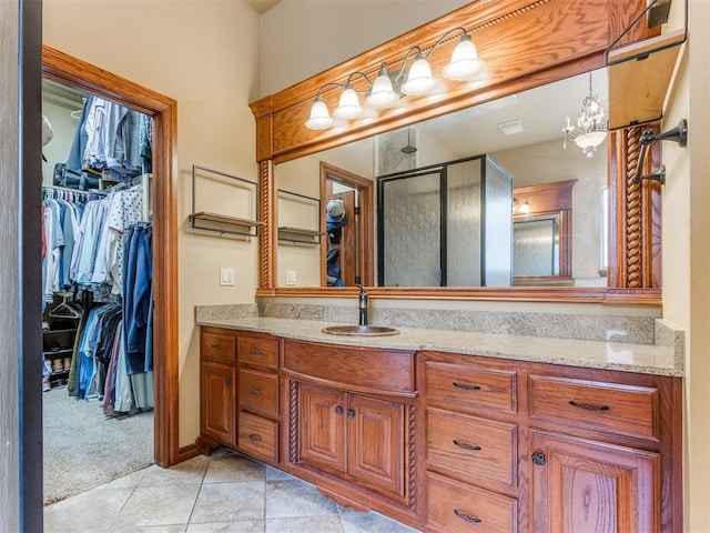 3116 Sycamore Dr, Moore, OK 73160 - full bathroom with tile patterned floors, a shower stall, vanity, and a spacious closet