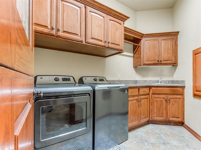 3116 Sycamore Dr, Moore, OK 73160 - laundry area featuring baseboards, washer and dryer, cabinet space, and a sink