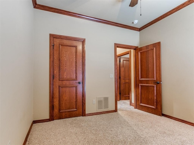 3116 Sycamore Dr, Moore, OK 73160 - unfurnished bedroom with crown molding, visible vents, carpet flooring, and baseboards