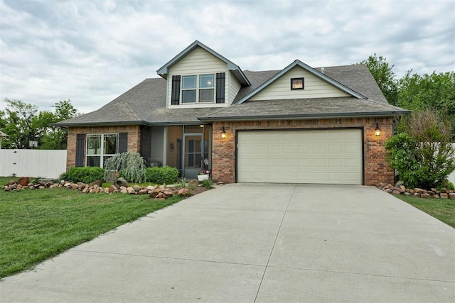43855 Hunters Hill Dr, Shawnee, OK 74801 - view of front of property with brick siding, driveway, a garage, and a shingled roof