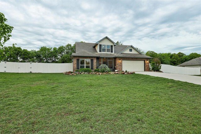 43855 Hunters Hill Dr, Shawnee, OK 74801 - view of front of property with driveway, brick siding, and a garage