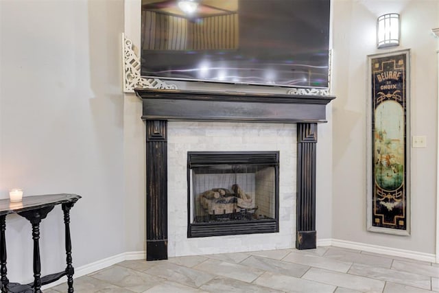 43855 Hunters Hill Dr, Shawnee, OK 74801 - detailed view of baseboards, a fireplace, and a ceiling fan