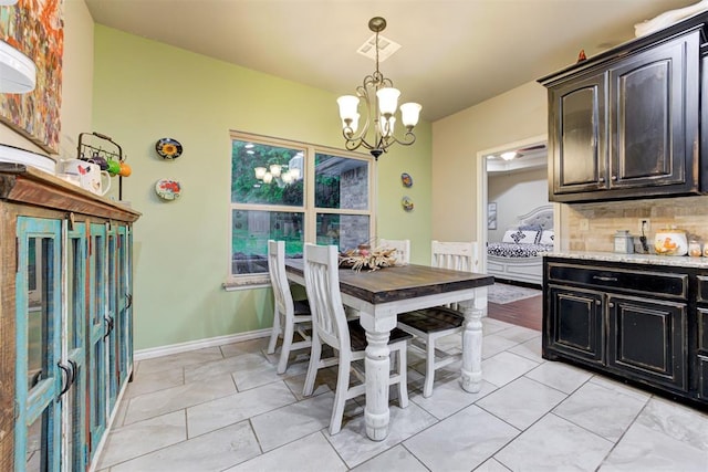 43855 Hunters Hill Dr, Shawnee, OK 74801 - dining area featuring a chandelier and light tile patterned floors