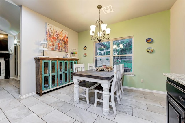 43855 Hunters Hill Dr, Shawnee, OK 74801 - dining area with a chandelier and baseboards