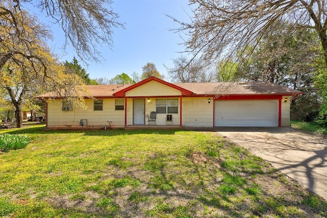 ranch-style home featuring an attached garage, a front lawn, and concrete driveway