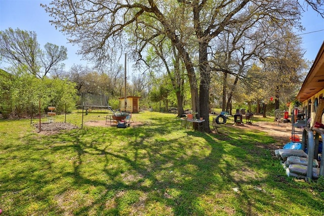 view of yard featuring a trampoline