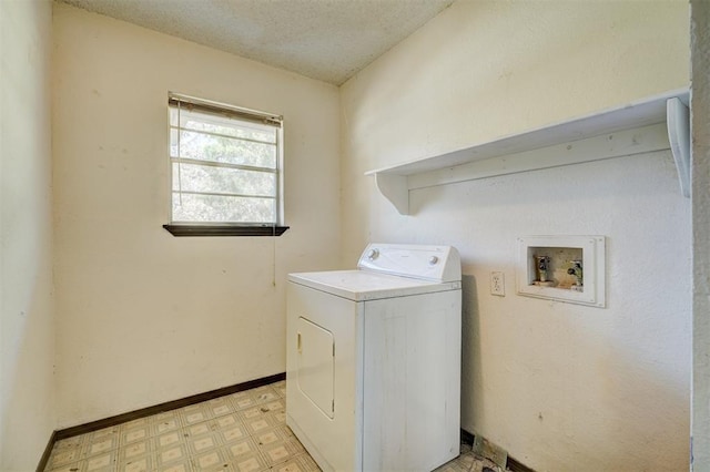 washroom with light floors, baseboards, laundry area, and washer / dryer