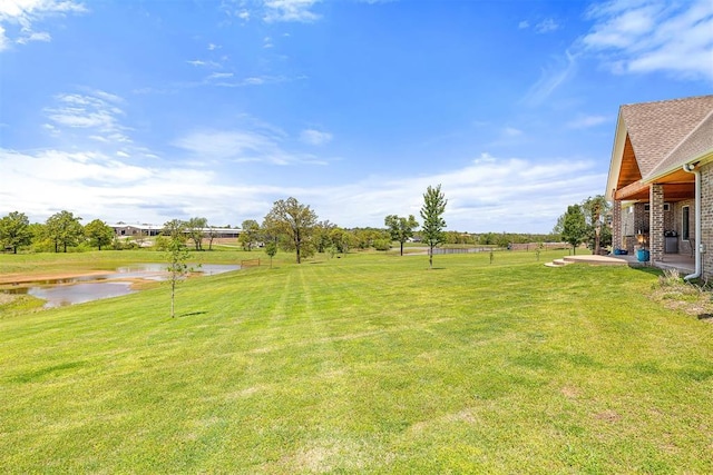 view of yard with a water view