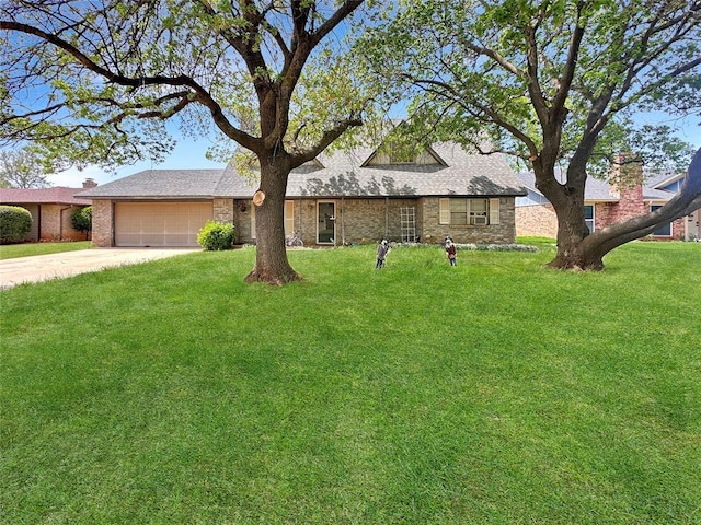 single story home featuring an attached garage, driveway, a front lawn, and brick siding