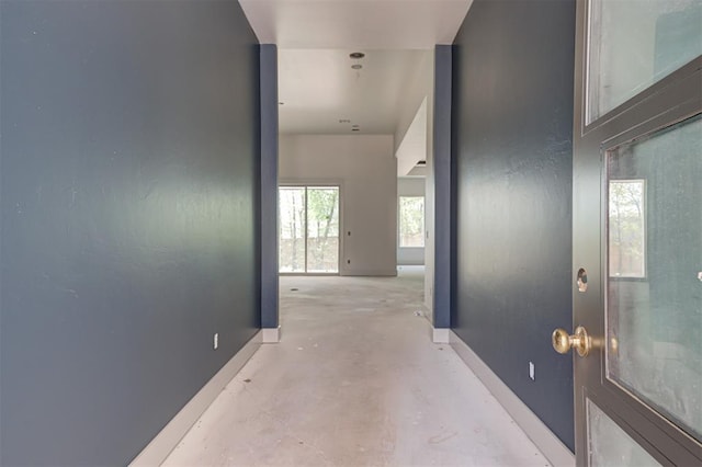3825 Stone Hill Ln, Edmond, OK 73034 - hallway with concrete floors and baseboards