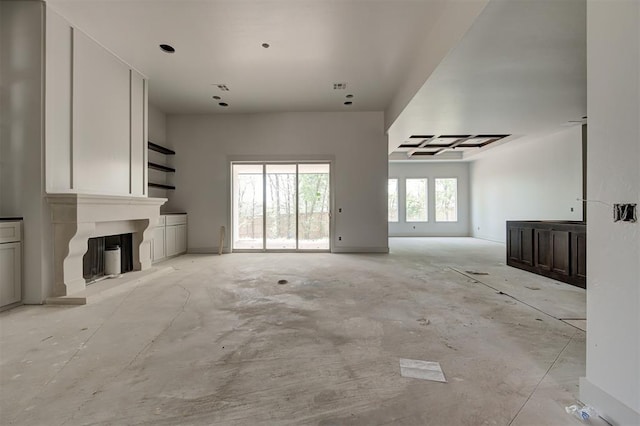 3825 Stone Hill Ln, Edmond, OK 73034 - unfurnished living room with a large fireplace and visible vents