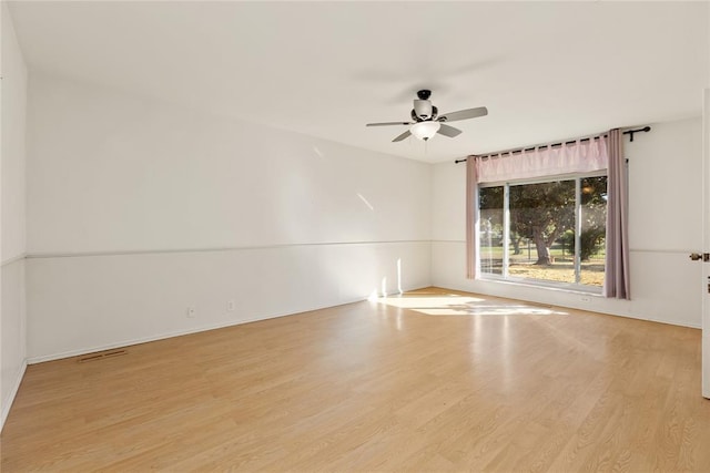 12600 Green Valley Dr, Oklahoma City, OK 73120 - unfurnished room with visible vents, baseboards, a ceiling fan, and wood finished floors